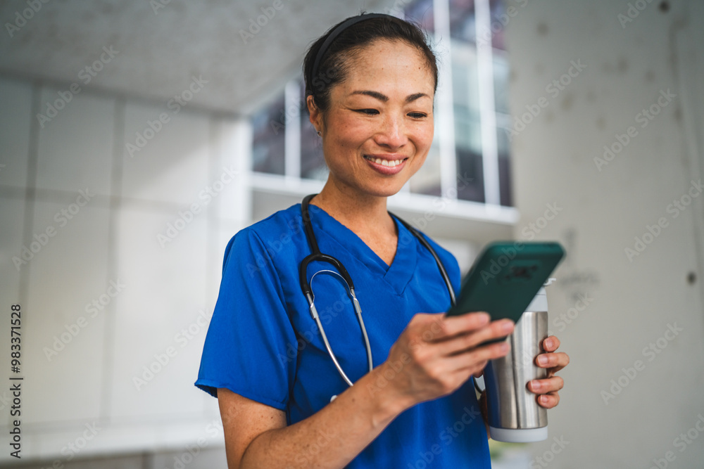 japanese doctor stand and use cellphone in front of modern building japanese doctor stand and use cellphone in front of modern building