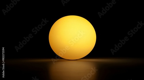 Vibrant Yellow Sphere Illuminating a Dark Background