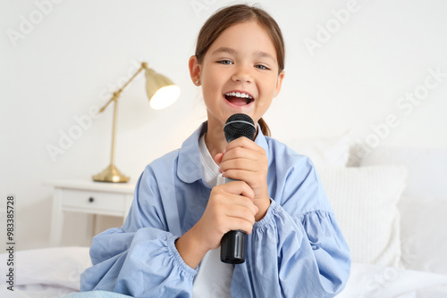 Little girl with microphone...