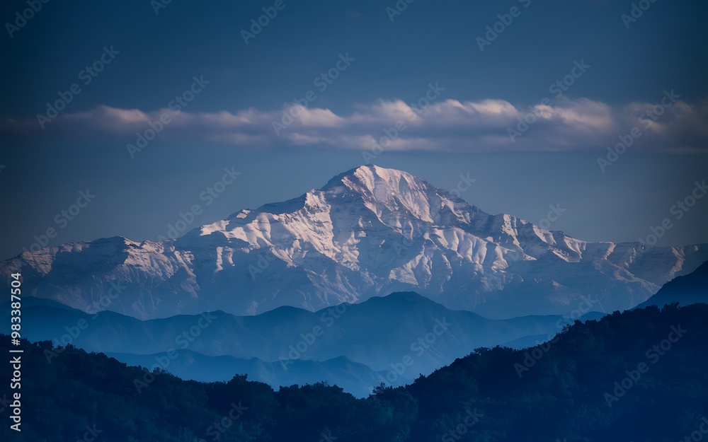 A majestic snow-capped mountain peak rises against a clear blue sky, surrounded by layers of misty hills. Generative-Ai A majestic snow-capped mountain peak rises against a clear blue sky, surrounded by layers of misty hills. Generative-Ai