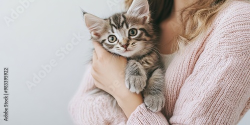 Childless cat lady - woman holding adorable kitten, solid background, copy space  photo