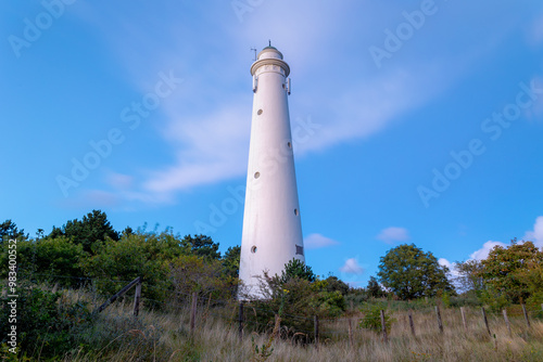 The white lighthouse with sunset skyline, The south tower (Zuidertoren) or water tower, Schiermonnikoog is a municipality and national park in the Northern Netherlands, One of the West Frisian Islands