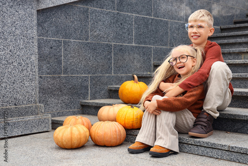 Happy children with pumpkin...