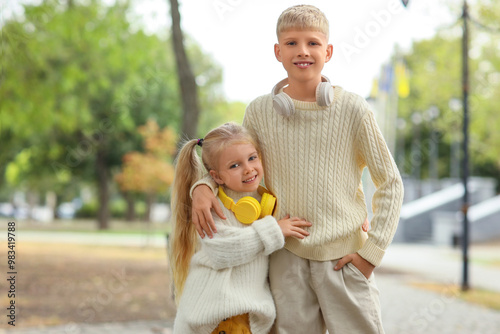 Happy children with headpho...