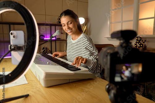 Female music blogger playin...