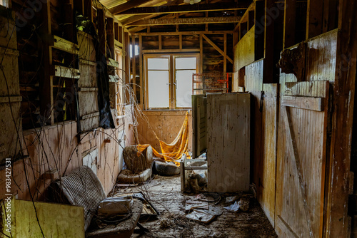 Destroyed abandoned farm shed interior on farmland in Whakamaru, Mangakino, Waikato, New Zealand. photo