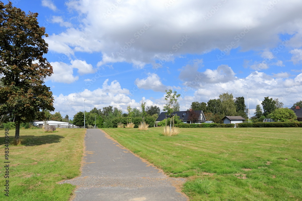 Naklejka premium Summer road for walking. Small village town. Västergötland, Sweden, Europe.