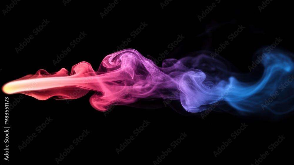 Colorful abstract smoke swirls on a black background with a sense of ethereal movement Colorful abstract smoke swirls on a black background with a sense of ethereal movement
