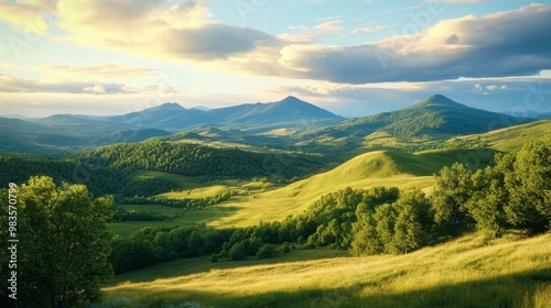 A serene image of the Auvergne volcanoes, with rolling hills and lush greenery.