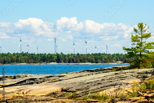 Green economy: wind turbines on Georgian Bay Ontario in summer room for text photo