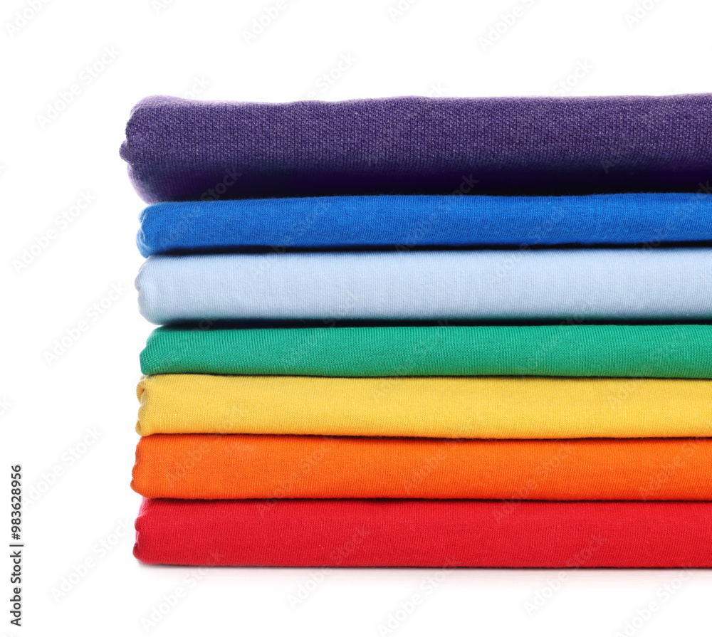 Stack of clean colorful t-shirts isolated on white Stack of clean colorful t-shirts isolated on white