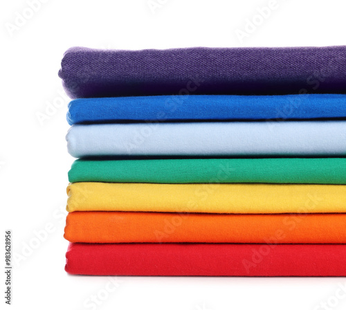 Stack of clean colorful t-shirts isolated on white