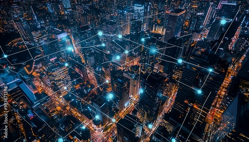 Night aerial shot of city center lit by digital connections over finance areas.