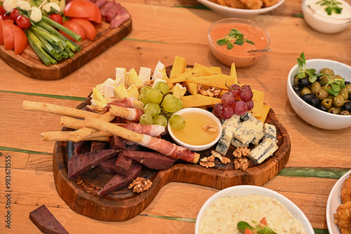 Plate with grapes, smoked meat and cheese with mold, Romania 2024, Romania 2024
