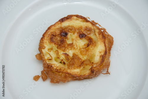 Plate with fried pumpkin slices with egg, Romania 2024