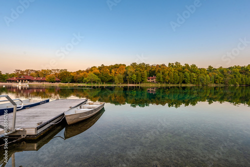 Captivating sunset at Green Lakes Park in Syracuse, NY, showcasing crystal clear waters, lush forests, and serene reflections. Ideal for nature lovers and peaceful getaways.