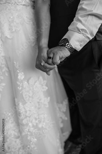 Black and White Bride and Groom Holding Hands