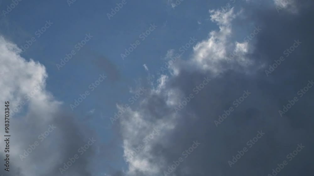 Dramatic timelapse of dark clouds in a blue sky. Time lapse footage of dark clouds. Dark clouds move like waves covering the sky. 4K, 60Fps available for slow motion Dramatic timelapse of dark clouds in a blue sky. Time lapse footage of dark clouds. Dark clouds move like waves covering the sky. 4K, 60Fps available for slow motion