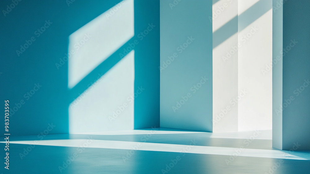 Soft blue shadows cast across a modern minimalist interior during the afternoon light Soft blue shadows cast across a modern minimalist interior during the afternoon light