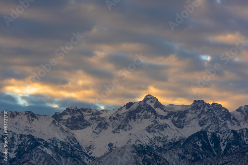 Mountain range under the expressive sky at dawn