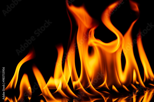 Fire flames on black background. Fire burn flame isolated, abstract texture. Flaming effect with burning fire. photo