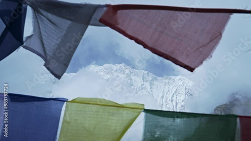 Prayer Flags in Snowcapped Mountains in Nepal, Close Up Colorful Tibetan Buddhist Prayer Flags in the Himalayas Blowing in the Wind in Annapurna, Colourful Religious Symbol of Buddhism in Nature