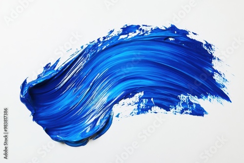 A simple yet striking image of a broad, textured brushstroke in vibrant blue paint