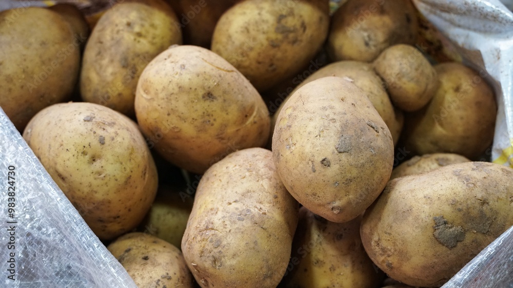 Close Up of Brown Potatoes in a Bag Close Up of Brown Potatoes in a Bag