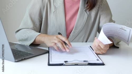 Business woman employer holds resume and talks with job applicant for job interview about her career and personal history in company, recruitment concept.


