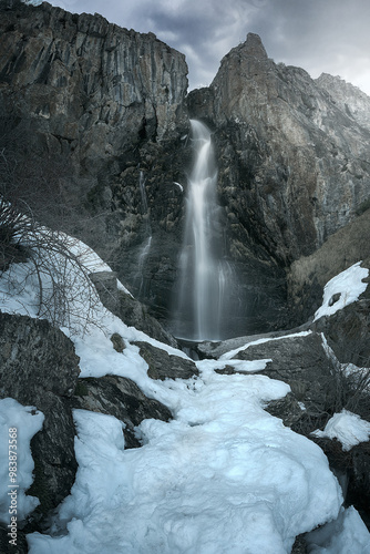 Mazobre waterfall in the Palencia mountain on a snowy winter afternoon