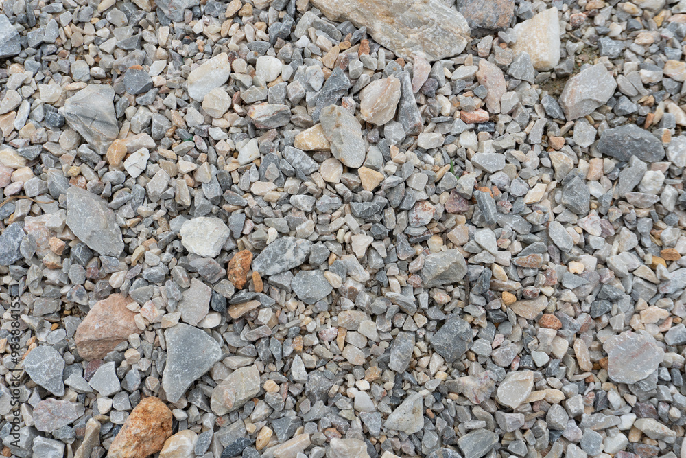Rough textured background showing a variety of small crushed gravel rocks Rough textured background showing a variety of small crushed gravel rocks