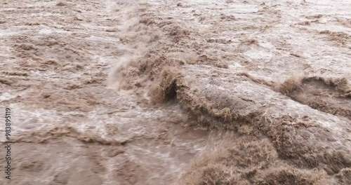 close up of flood water flowing in the river