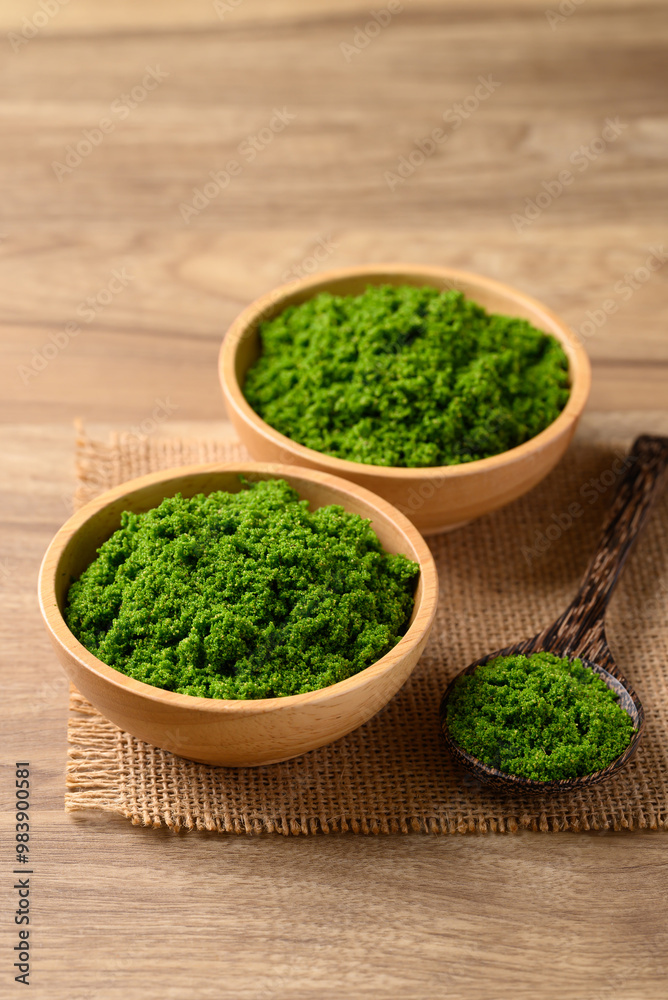 Wolffia or watermeal in bowl with spoon, Edible small aquatic plant high protein Wolffia or watermeal in bowl with spoon, Edible small aquatic plant high protein