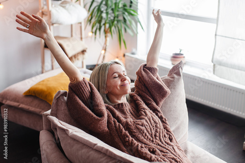 Happy middle aged Woman relaxing at home