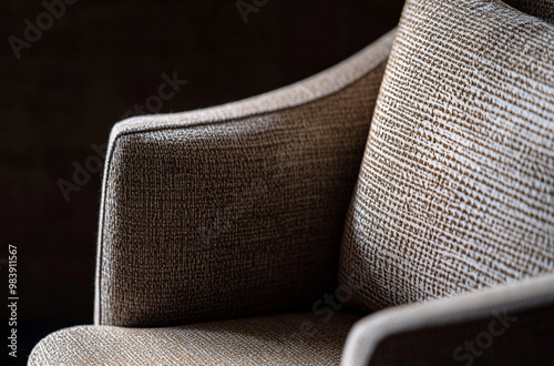 A macro shot focusing on the elegant armrest of an armchair
