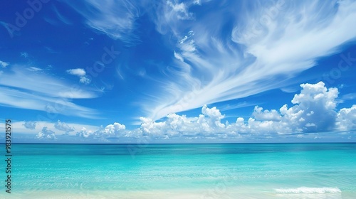 A beautiful scene of the blue ocean against the blue sky background. The ocean stretches out as far as the eye can see, with its surface glistening in the sunlight photo