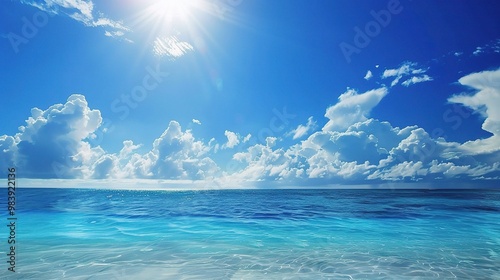 A beautiful scene of the blue ocean against the blue sky background. The ocean stretches out as far as the eye can see, with its surface glistening in the sunlight photo