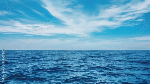 Wallpaper Mural A beautiful scene of the blue ocean against the blue sky background. The ocean stretches out as far as the eye can see, with its surface glistening in the sunlight Torontodigital.ca
