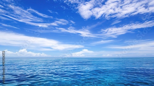Wallpaper Mural A beautiful scene of the blue ocean against the blue sky background. The ocean stretches out as far as the eye can see, with its surface glistening in the sunlight Torontodigital.ca