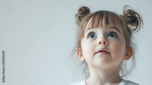 Portrait of a curious child gazing with wonder, isolated against a clean background with ample space for text. Capturing the innocence, exploration, and imagination of childhood in a simple and unclut