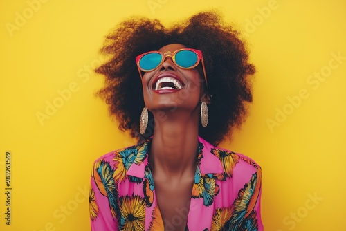 A woman with a big smile on her face is wearing sunglasses and a colorful outfit. She is posing for a photo and she is happy and carefree photo