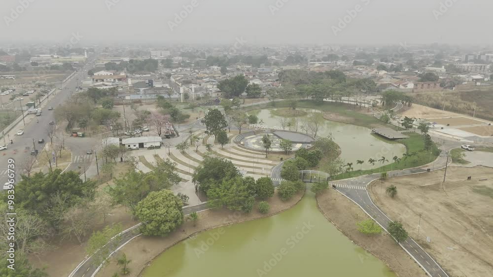 Drone flies east over Parque da Cidade on smokey afternoon from wildfires in Porto Velho, Rondônia, Brazil
