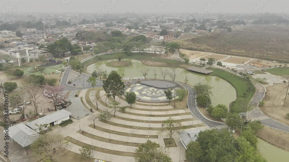Drone flies over main entrance to Parque da Cidade on smokey afternoon from wildfires in Porto Velho, Rondônia, Brazil