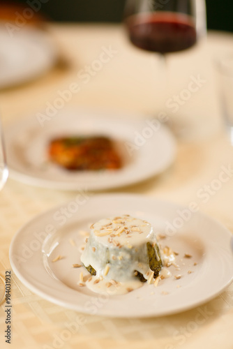 Close up on italian traditional northern food on a restaurant table. Many dishes are visible.