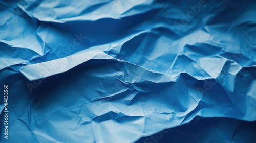 Wallpaper Mural Close-up of a blue sheet of paper with creases and folds visible, providing a textured background or template for various design uses Torontodigital.ca