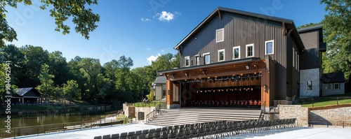 A riverside theater with weather-resistant James Hardie siding, offering year-round performances in a picturesque setting that melds natural beauty with cultural expression photo