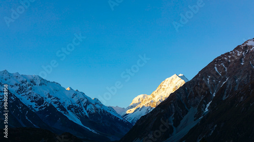 The mountain view of alpine as snow-capped mount peaks in Winter mountains