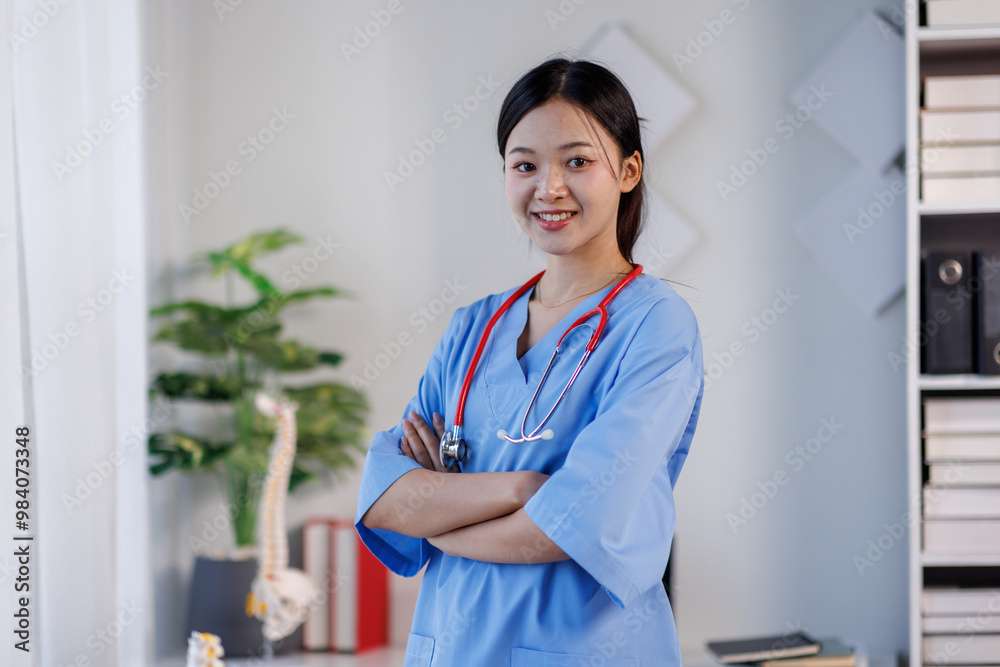 Confident Young female doctor or nurse arms crossed with stethoscope in hospital Confident Young female doctor or nurse arms crossed with stethoscope in hospital