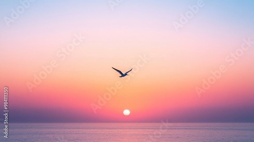 A peaceful sky at dawn, with a single bird flying across the horizon as the sun begins to rise