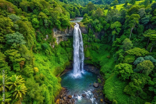 Birds eye view of a beautiful waterfall in a lush tropical rainforest